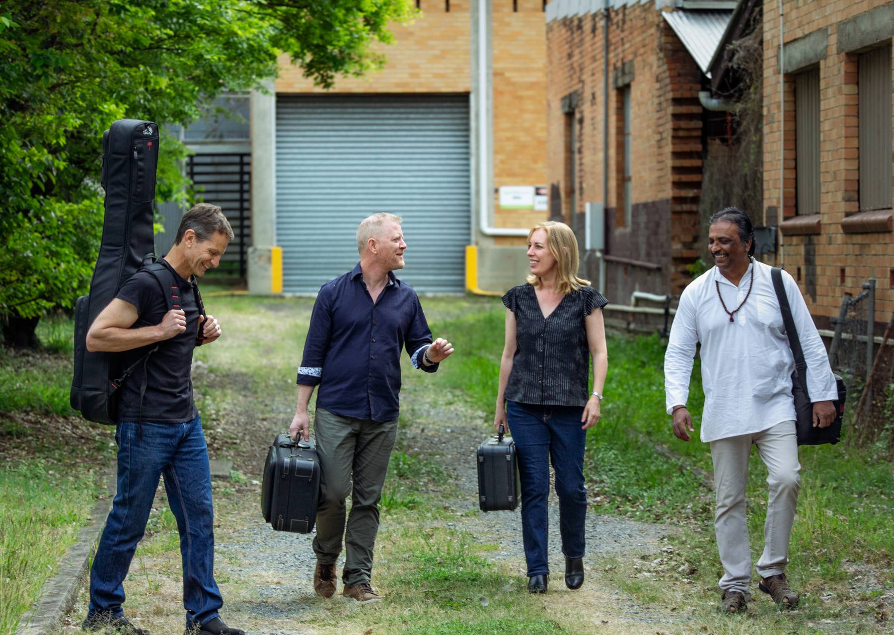 Jazz Eclectic — Calvin Raison, Trent Jordan, Katrina Fawns and Dave Fernandez walking with their instruments