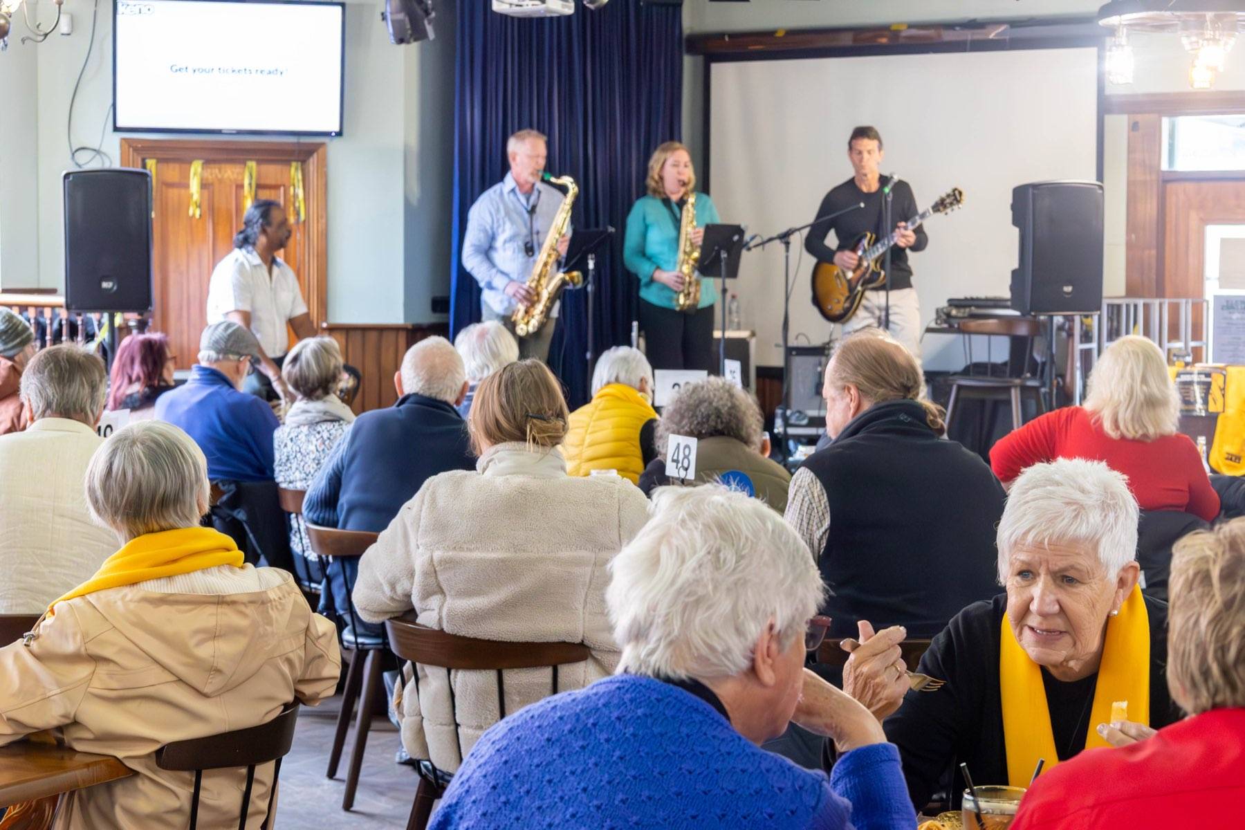 Jazz Eclectic performing to a seated audience at a community venue, August 2024